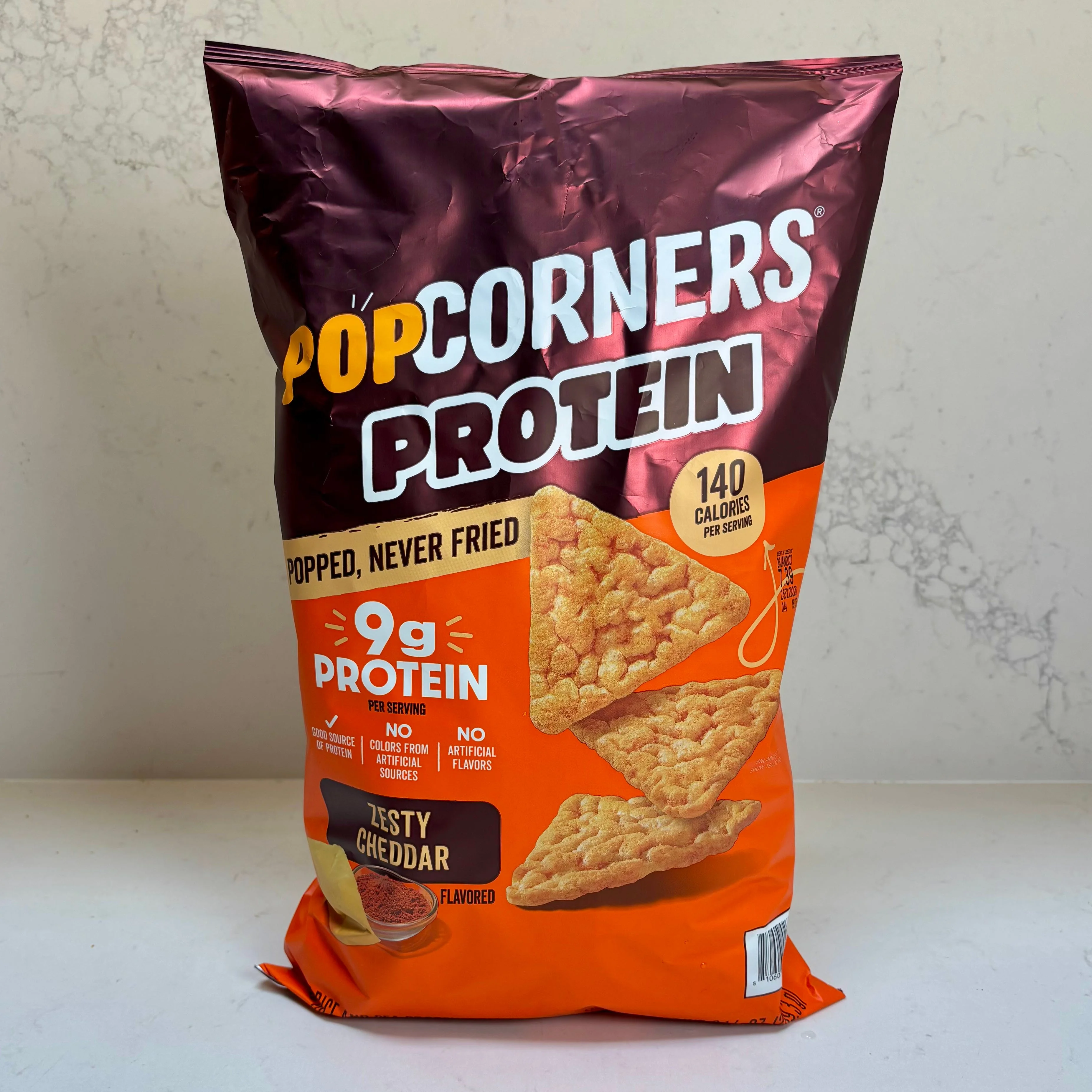 Bag of PopCorners Protein Zesty Cheddar snack.