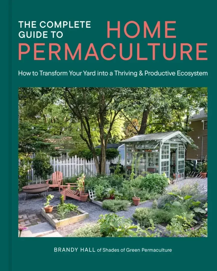 Cover image of the book The Complete Guide to Home Permaculture, featuring a greenery-rich garden.